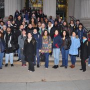 student group photo standing on the main steps of MIT 